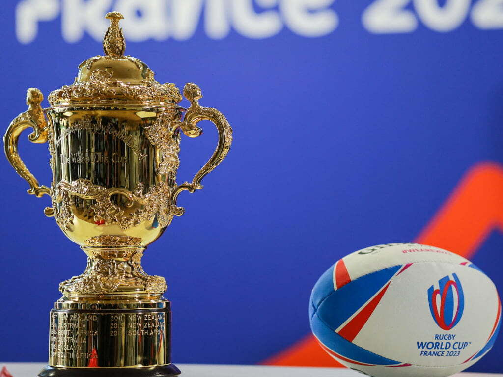 World-Cup-trophy-and-ball-gameonfield Rugby World Cup 2023 - A Saga of Suspense, Passion, and Victory